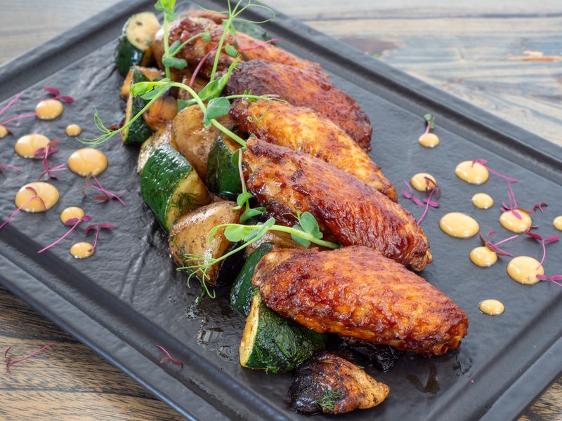 Crispy golden chicken wings fresh from the fryer at Wing Snob